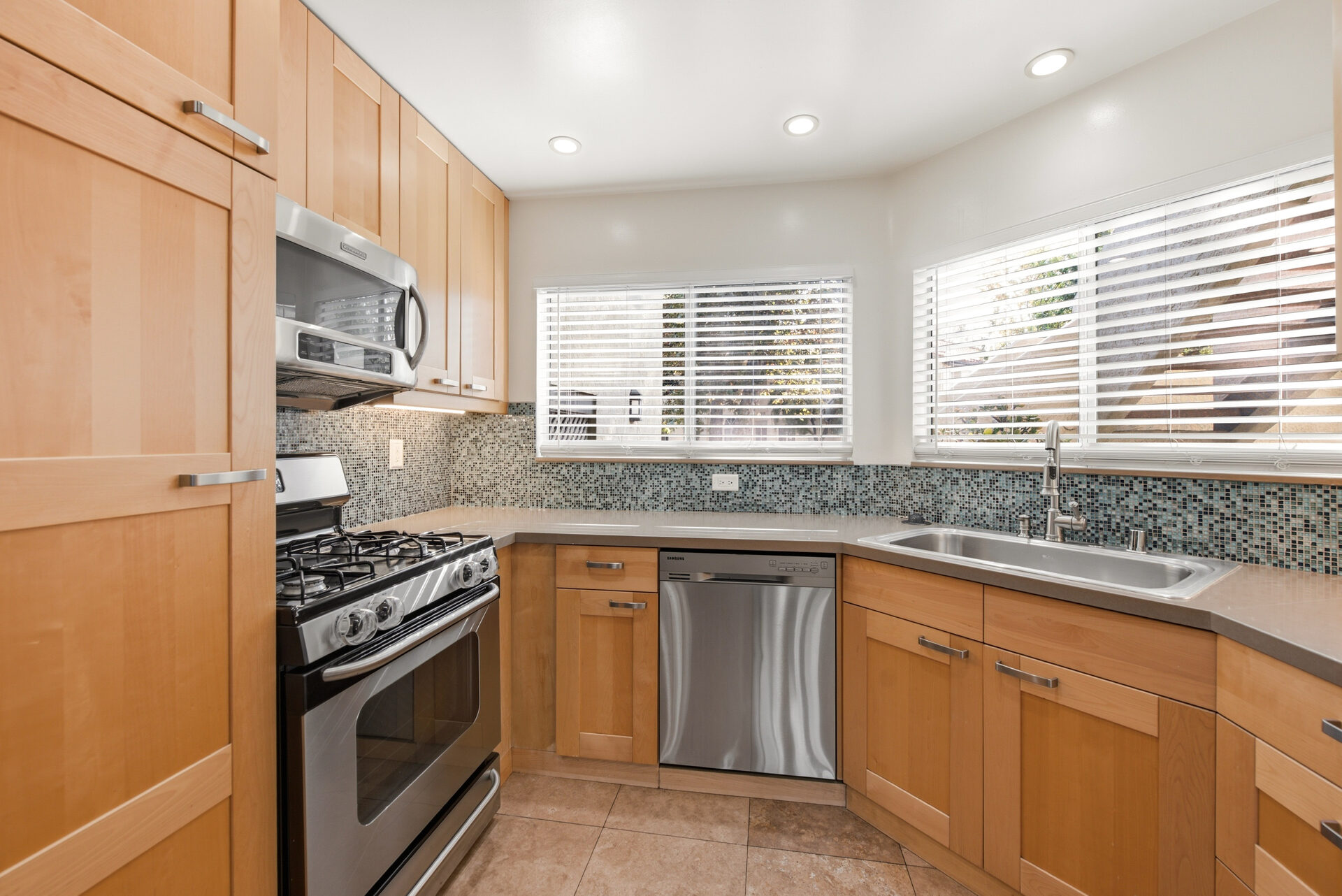 Kitchen · range and glass tile backsplash