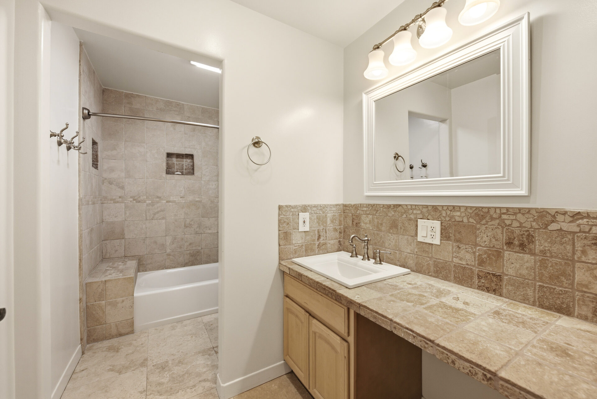 Upgraded bathroom · stone-tile vanity