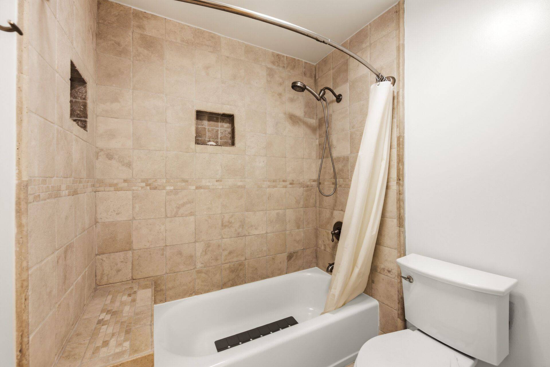 Upgraded bathroom · shower-over-tub with bench
